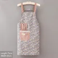 Detail of floral apron with pink polka dot pockets, lace trim and rabbit ear accents - Bunny Pocket Floral Apron-Blue