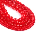 Polished red chalcedony round beads in various sizes from 4mm to 12mm on white background - Red Chalcedony