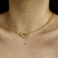 Close-up of 18K gold plated necklace with circular pendant worn by a model - O-Chain