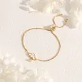 Detail of 18K gold plated adjustable slider bracelet featuring a white cloud pendant - Cloud