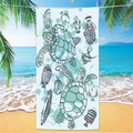 Microfiber beach towel with sea turtle and tropical fish print on a sunny beach - Sea Turtle Beach Towel 7