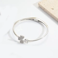 Silver open bracelet featuring sparkling clover and clear zircon in minimalist design - Four-Leaf Clover / Silver