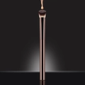 Flat top foundation brush with bronze handle and a liquid drop on dense bristles - Crescent Concealer Brush