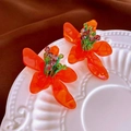 Floral beaded earrings with orange resin petals and green beads in a white ceramic dish - Orange (77# Silver Earring Post)