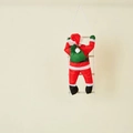 Christmas Santa Claus climbing on a white three-step rope ladder with green gift bag - 60CM Climbing Ladder Santa