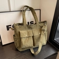 Olive green corduroy tote bag with multiple pockets and adjustable shoulder strap - Green