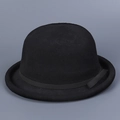 Close-up of vintage black knit bowler hat with rolled brim and delicate ribbon bow detail - M (56-58cm) / Black
