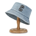 Light blue denim bucket hat with checkered C embroidery on a wooden hat stand - Letter C Patch Light Blue