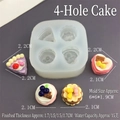 Detalle macro de molde de silicona de 4 cavidades con muestras de resina acabadas - Molde de Pastel de 4 Cavidades