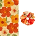 Detailed view of a satin floral scrunchie with French oil painting patterns and texture - Orange Small Flowers