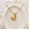 3D balloon-style golden letter J necklace with snake chain on vintage frame - Gold Letter J