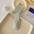 Light green cotton crew socks with ribbed knit texture on minimalist display - One Size / Milky Green