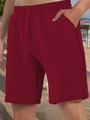Close-up of wine red casual shorts featuring a drawstring waist and waffle knit texture - S / Burgundy