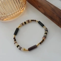 Ethnic beaded bracelet with black cylinder beads, brown discs and golden accents - Persian Agate Bracelet SL0152