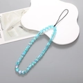 Close-up of translucent light blue heart beads with iridescent finish on mobile phone strap - Blue Enamel