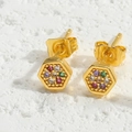Macro detail of hexagonal gold earrings with vibrant colorful cubic zirconia inlay - Hexagon