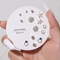 Detail of 7 pairs of assorted silver earrings with purple gems and pearls on a white card - E0488-1 (Silver Blue Purple Gem Set)