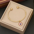 Bracciale rigido dorato in acciaio inossidabile con ciondolo occhio rosa in scatola beige - Rosa