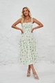 Detail of white floral sundress showing spaghetti straps and lace-up neckline design - White with Light Green Leaves