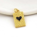 Macro shot of 18k gold plated heart pendant with black enamel on white ceramic tray - 03-Rectangular Black Heart