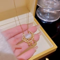 Elegant gold Ruyi lock necklace featuring a cat-eye stone and delicate diamond accents - X105 Ruyi Lock with Opal
