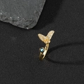 Detailed close-up of golden open ring with zircon butterfly and evil eye bead - E-Butterfly Bead Evil Eye