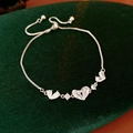 Silver finish heart bracelet with clear cubic zirconia on premium velvet backing - Silver