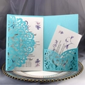Exquisite laser-cut blue wedding invitation suite with intricate lace pattern details - Tiffany Blue