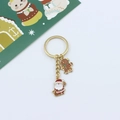 Detail of Christmas keychain with gingerbread man and Santa Claus enamel charms - Santa Claus & Gingerbread Man