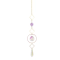 Macro detail of hanging crystal ornament with purple raw stone and golden metal frames - Style K