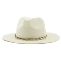 Detailed close-up of handmade cream straw cowboy hat with shell decorative band - Creamy White