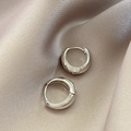 Polished silver geometric hoop earrings with hinged clasp on a satin fabric background - E6013 Silver Polished Hoops