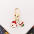Detail of gold metal keychain with enamel Santa Claus and rhinestone Christmas glove pendants - Santa Claus-5 (with Rhinestone Glove)