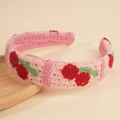 Detailed close-up of handmade pink knitted headband with 3D cherry and leaf crochet - Pink Cherry