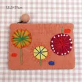 Handmade orange wool felt purse with floral embroidery and ball zipper detail - Orange
