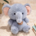 Cute sitting elephant plush toy in light blue-grey with soft ears and leather tag - Sitting Elephant
