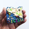 Detailed relief design of a resin Sicily map fridge magnet showing Italian landmarks - Creative Sicily Map