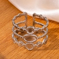 Silver multi-layer wavy open ring in titanium steel on a natural silk and wood background - Steel Color 34