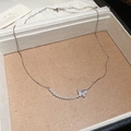 Detailed macro view of 18k gold plated butterfly pendant with shimmering zircon and pearls - Silver Necklace