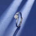 Silver S925 sterling silver ring with a clear round moissanite stone on blue surface - One-carat Twisted Band Ring Ljz-170 / Adjustable Open