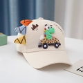Detail of beige baby baseball cap featuring 3D dinosaur accents and ROAR embroidery - 6M-3Y/Circumference 46-50cm / Skateboard Dino Beige