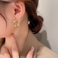 Close-up of gold plated twisted U-shape hoop earrings worn by a model for daily wear - Minimalist U-Shape Square Ear Buckle (26# Ear Buckle-Gold)