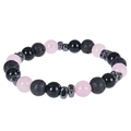 Macro detail of natural lava rock, pink beads, and polished black stones on a beaded bracelet - Rose Quartz Bracelet