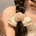 Close-up of a pink mesh rose and floral bow hair claw clip styled on a braided hairstyle - 079 Pink Camellia Hair Clip