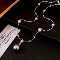 Detailed view of dark purple and light pink pearl necklace on a premium black display - Adjustable Pearl Zircon Necklace / Purple-Pink