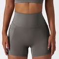Grey high-waisted yoga shorts with side pockets and quick-dry compression fabric - Ultimate Gray