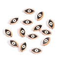 Macro view of 10mm golden devil eye charms with enamel finish and side drill holes - Eye / Black