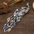 Silver peacock brooch with blue and purple rhinestones and cascading metal tassels - Purple Multi-color