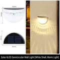 White semi-circular solar wall light with 6 LEDs emitting warm light for outdoor decor - 6LED/White Shell/Warm Light