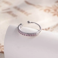 Minimalist silver cuff earring featuring a row of pink round gems on a white stand - Zirconia Pink (A773-2)